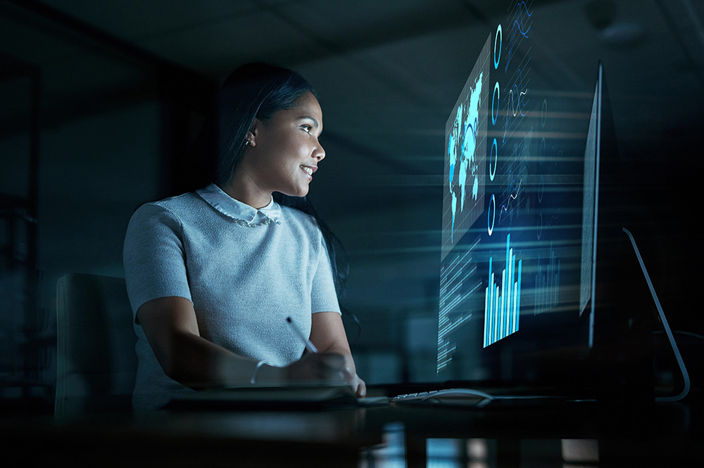 Business woman working at computer and happy